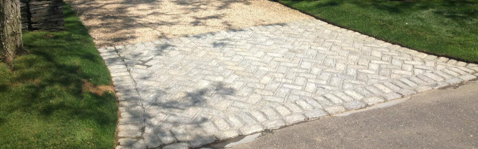<p>Edging is often chosen to clearly define the driveway and parking areas. It is completely optional, and is often chosen in order to obtain a clean finished look.  We commonly install either a Metal Edge or a Belgian Block Edge around the driveway perimeter.  If this is something you are […]</p>
